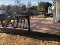 <b>Trex Transcend Tiki Torch Decking with Ultralox Black Aluminum Railing and Matching Tiki Torch Fascia around perimeter</b>